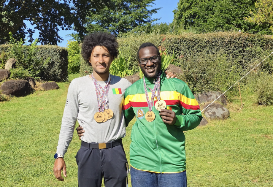 Ndiaye and fellow Senegalese athlete showing off medals after wins Wally Ndiaye Paddler Medal
